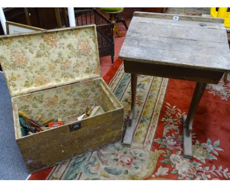 A PITCH PINE CARPENTER'S TOOLBOX with wallpaper lined interior and a few old hand tools and a stripped wood school desk