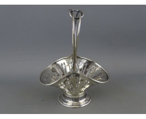 A MINIATURE SILVER SHAPED BASKET on a circular base and with a double intertwined centre handle, maker Asprey, 2 troy ozs, Bi