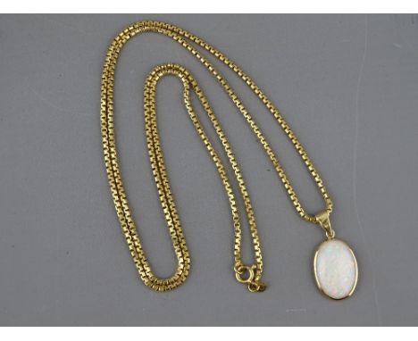 AN EIGHTEEN CARAT GOLD BOX CHAIN, 70 cms long, approximately 20 grms together with an opal pendant, 1.9 x 1.2 cms, 21 grms gr