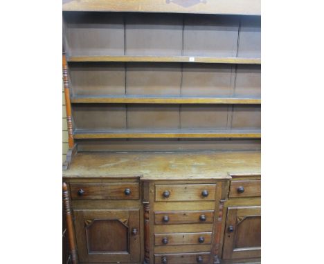 A 19th CENTURY ANGLESEY OAK &amp; MAHOGANY BREAKFRONT DRESSER, the three shelf wide boarded rack with Talwrn decoration over 