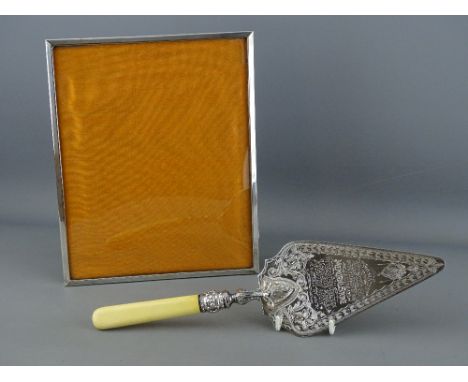 A SILVER PHOTOGRAPH FRAME, Birmingham 1972 and a silver plated presentation trowel dated November 10th, 1888