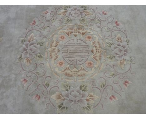 A WASHED CHINESE CARPET, light ground with floral pattern, 7.62 x 3.96 metres (measurements as per label)