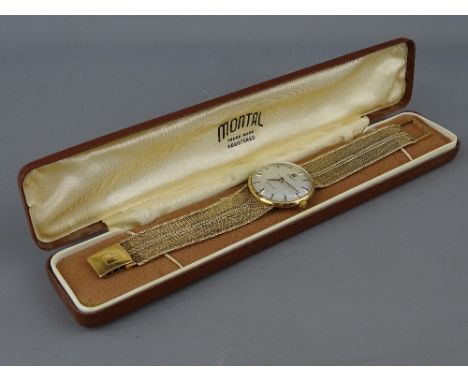 A NINE CARAT GOLD GENT'S TISSOT STYLIST WRISTWATCH with integral strap, stamped 9.375, 54 grms gross, in a vintage Montal cas