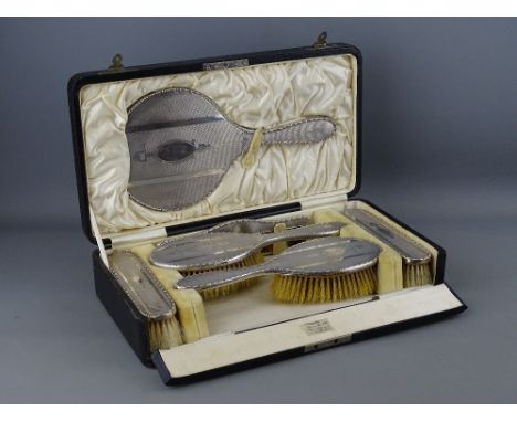 A FINE SIX PIECE CASED MANICURE SET, all pieces with fine quality silver backs, all marked for Chester 1924 and in a Russells