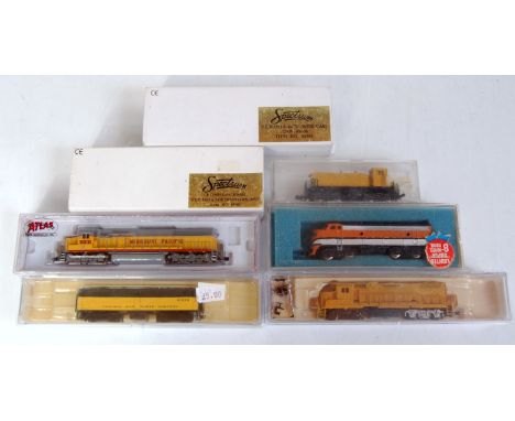 7 assorted N gauge including 6x diesel locomotives and a dummy 3 unit including Atlas Missouri Pacific SD50 (NM-BNM), Bachman