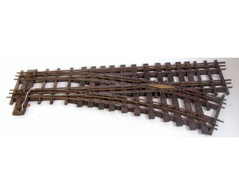 3 rail steel track on wooden battens with brass centre rail double junction point fitted with manual level, would benefit fro