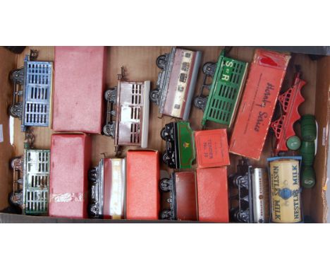 A large tray containing 8 assorted Hornby postwar wagons including LMS No. 1 cattle (G) No. 31 1st/2nd coach (NM-BVG), No. 30
