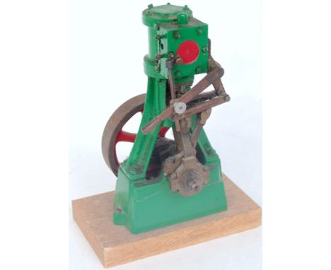 Stuart, No. 7A vertical steam engine, 1 inch bore x 1 inch stroke, having lever operated reversing gear, finished green with 