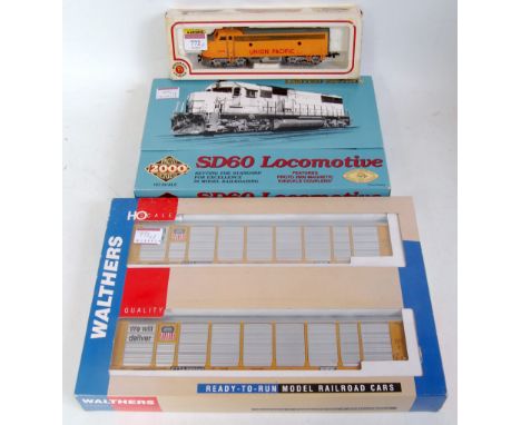 A Bachmann USA H0 Union Pacific F9 diesel No. 1206 (VG,BG), a Proto 2000 UP SD60 diesel No. 6005 (NM,BNM), and a pair of Walt