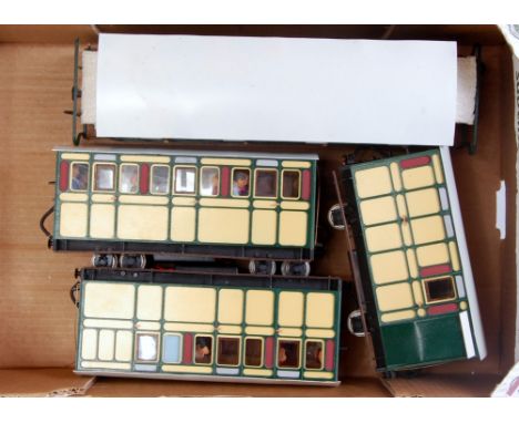 4x GI yellow/green wooden coaches fitted with passengers including 4 wheel 24cm brake van, 2x 4 wheel 30cm coaches, and a bog