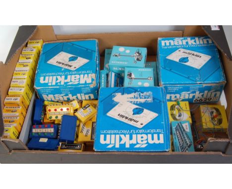 A quantity of Marklin H0 electrical accessories, including 3 AC transformer/controllers, switches, electric signals, lamps et