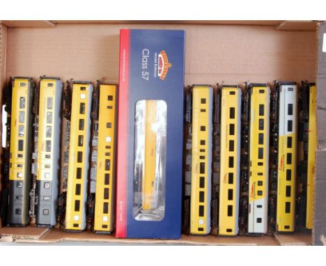 A Bachmann Class 57 diesel No. 57312 in Network Rail yellow livery (M,BM) with nine passenger coaches by various makers, all 