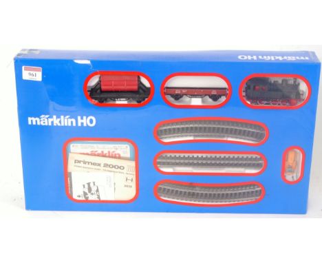 A Marklin H0 3-rail Primex 2000 Freight set, with 3029 0-6-0T, 2 wagons, track and controller (VG,BG)