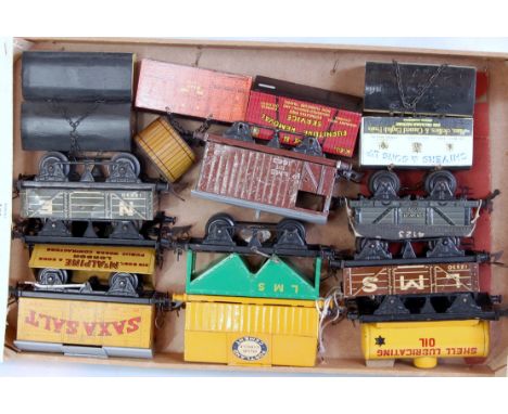 A small wooden tray of mainly postwar Hornby items including cement wagon, LMS hopper, No. 50 Saxa Salt, McAlpine side tipper