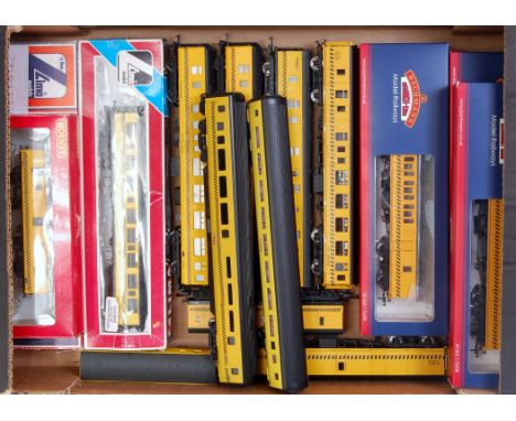 A collection of Engineers Departmental coaches in Network Rail engineers yellow, including 3 Bachmann breakdown tool vans (M,