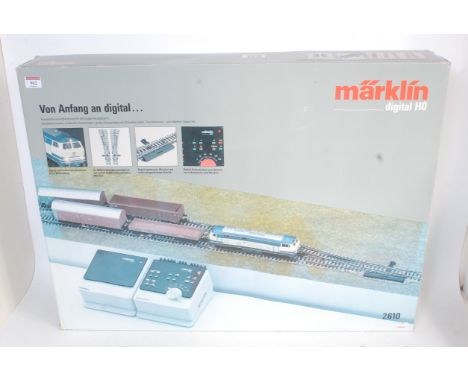 A Marklin H0 3-rail 2610 Digital freight set with 3074 DB BR216 diesel, 4 bogie wagons, back and digital transformer/controll