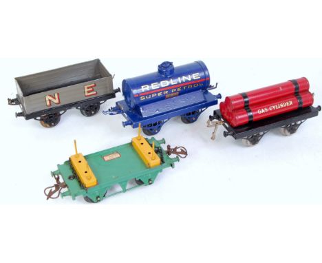 A small tray containing 4 prewar Hornby wagons including 1925-6 LNER Gas Cylinder wagon (G), 1928-30 Redline petrol tank wago