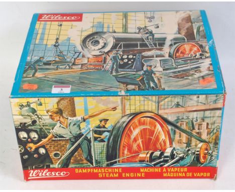 A boxed, Wilesco D20 steam engine, comprising tinplate base with brickwork effect boiler powering a single cylinder horizonta