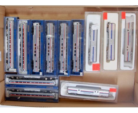 12 N gauge Amtrak passenger  cars, 8 by Bachmann and 4 by Con-Car, including 4 full dome cars, 4 coach cars, 2 baggage and 2 