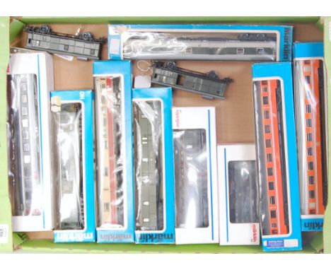 A tray containing 13 various Marklin coaches, including 4 different Eurofima orange livery, Swiss and German baggage vans, an