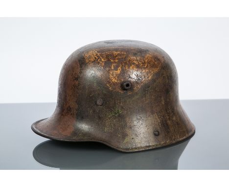 IMPERIAL GERMAN WWI 'STAHLHELM' METAL HELMET WITH HANDPAINTED CAMOUFLAGE
model M1916 or M1917, hand-painted in green, brown a