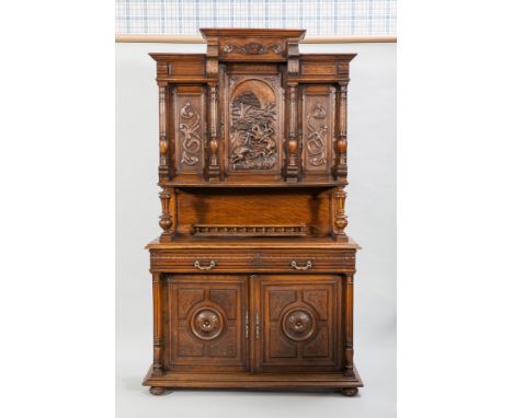 HEAVILY CARVED OAK BUFFET CUPBOARD OF 17TH CENTURY DUTCH DESIGN the lofty breakfront cornice with cupboards below enclosed by