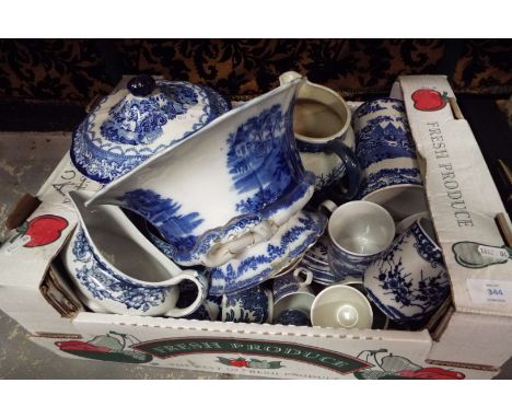 A box of assorted blue and white china to include Copeland Spode Italian plates, Booths water jug, cups and tureens