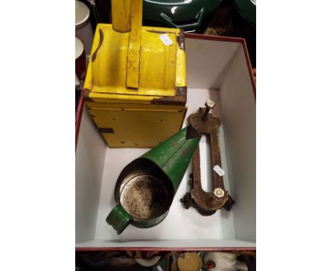 A Victorian iron door knocker together with a green oil jug and a road lamp