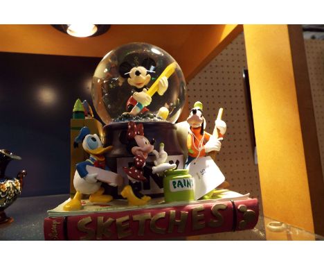A Walt Disney 'Sketches' musical snow globe