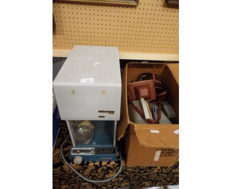 A Microwa Swiss 6020 pharmacists scales and a cine camera and two other cameras