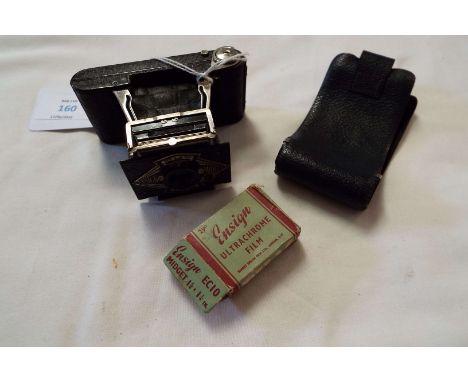 An unusual Ensign Midget bellows camera with case complete with two rolls of Ensign Ultrachrome film, boxed