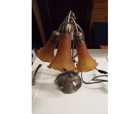 A brush brass art nouveau style three branch lily lamp