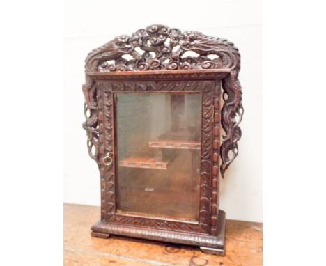 A Chinese design carved wood glazed display or smokers cabinet, 15" wide X 20" high 