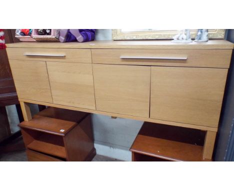 A contemporary light oak sideboard, fitted two drawers and cupboards under 