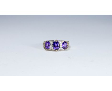 Three stone amethyst and diamond set half hoop ring in the Victorian style in 9ct yellow gold, ring size 'Q'