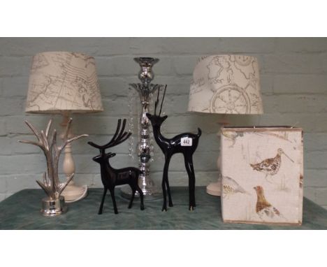 A plated lustre candlestick, a pair of cream table lamps with shades, antler ornaments, deer figures, Voyage game bird lamp s