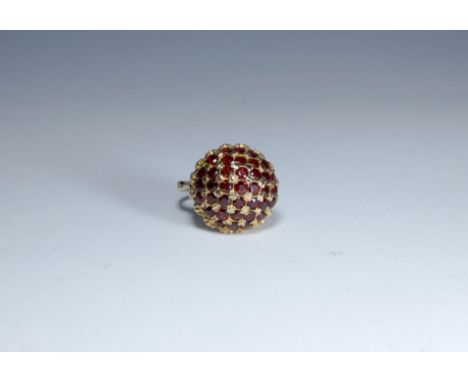 A garnet set circular bombe cocktail ring, on 9ct gold shank, ring size K 