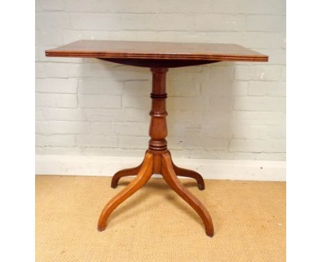 A rectangular polished mahogany occasional table on pillar and quadruple base 