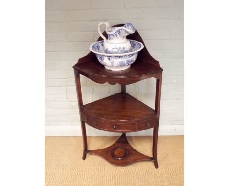 Georgian mahogany three tier corner wash stand with a blue tile jug and bowl 