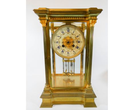 A Maple and Company striking mantel clock in brass and glass case with regulator movement, 13" high X 8" wide X 6" deep  