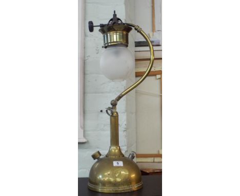 An early 20th century brass adjustable oil lamp 