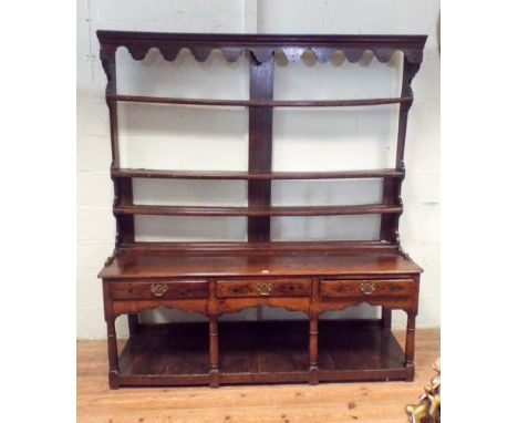 A late 17th Century Welsh oak dresser fitted three drawers with pot shelf under on turned legs with open shelf back 6' wide, 
