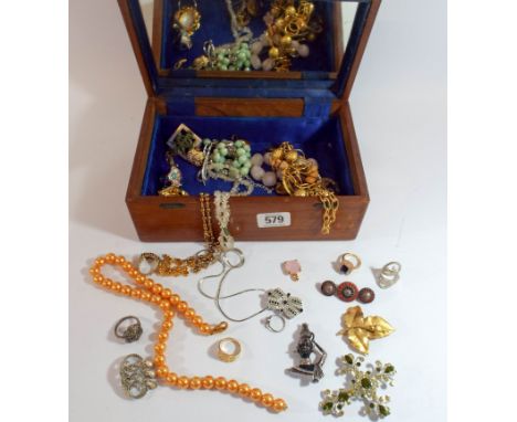 A collection of costume jewellery in a mahogany trinket box 