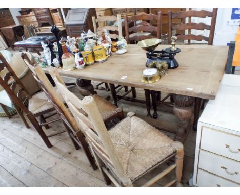 A stripped oak refectory style dining table approx 6' x 3' together with six oak stripped and plain ladder back dining chairs