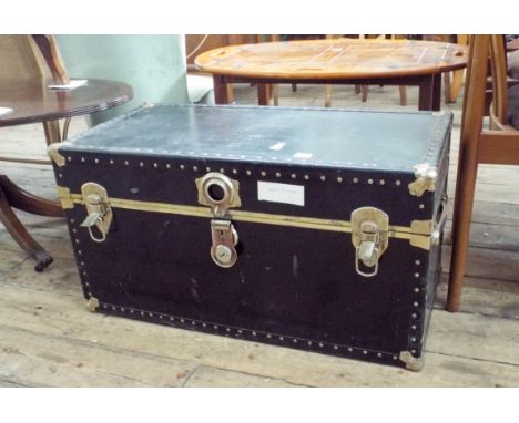 A black bound cabin trunk with interior tray 