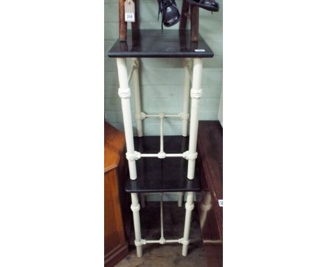 A pair of black marble and cream pained metal framed end or lamp tables 