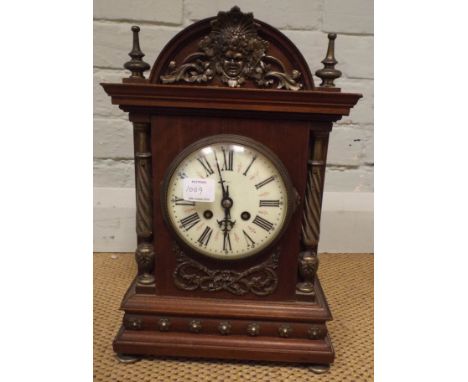 A late 19th century French striking mantle clock in decorative walnut case 
