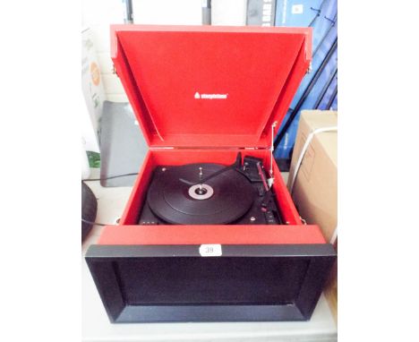 A red and black Steepletone record deck with FM and AM speaker 