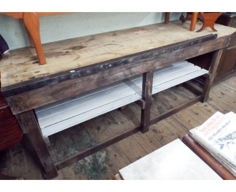 Heavy duty work bench with metal straight edge strip and under tier