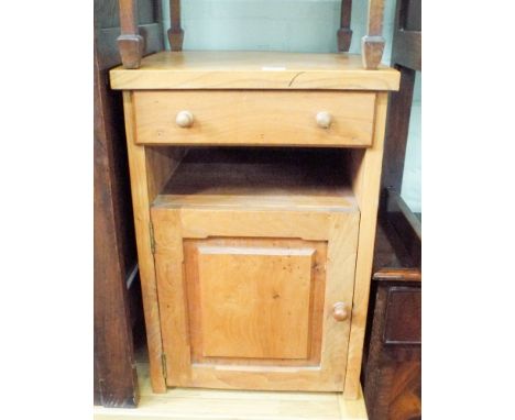 A well made light oak bedside cabinet fitted cupboard and drawer 